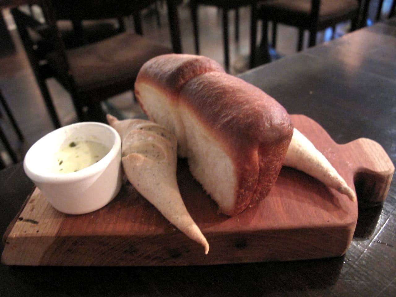 Cute house made bread with whipped butter. 