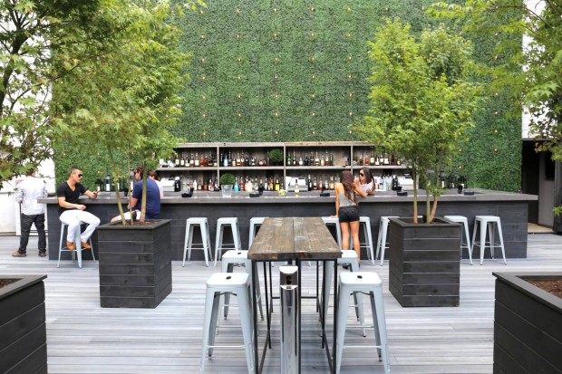 EFS Social Club rooftop patio offers chic patio furniture and DJ nights in King West Village.