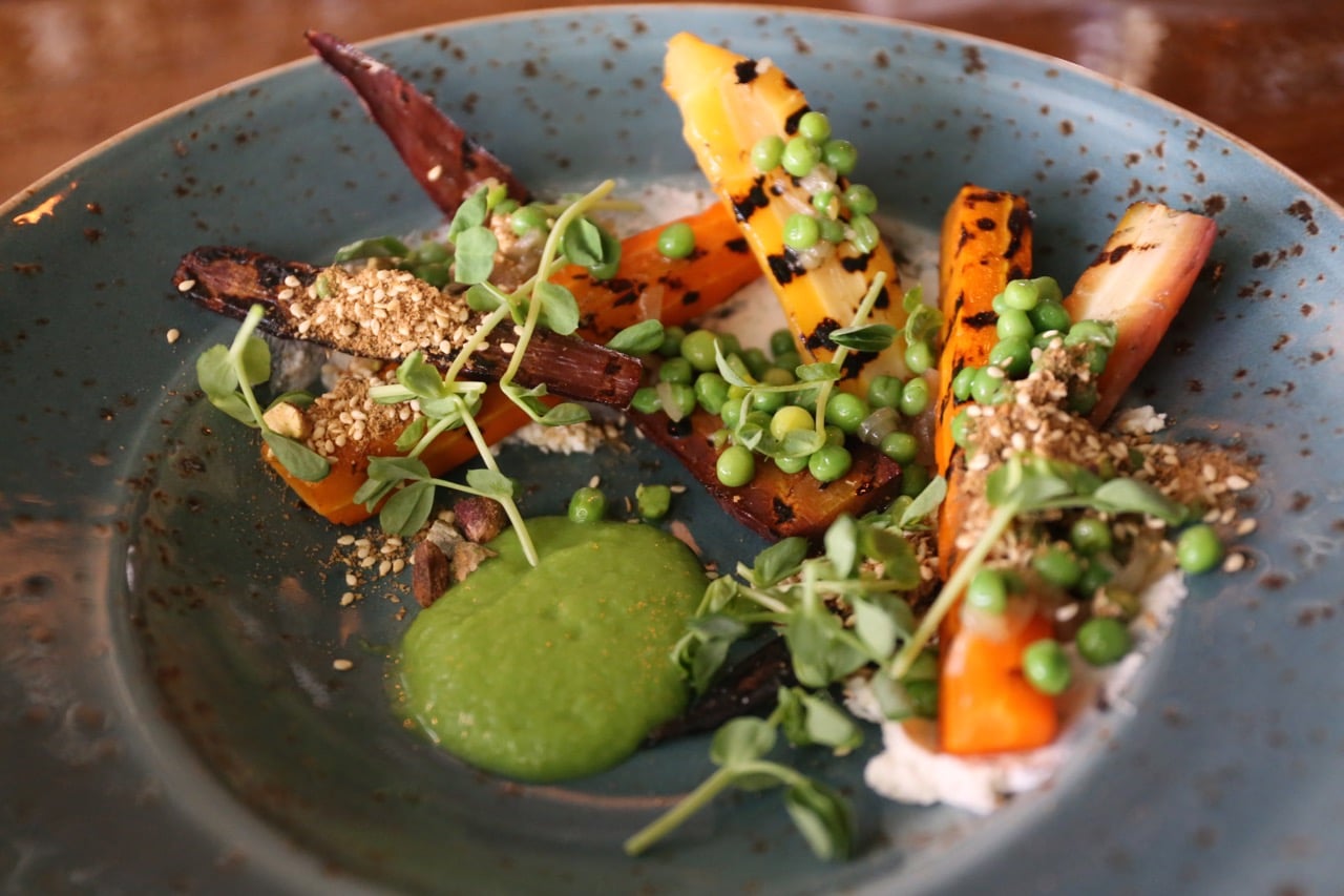 Grilled Carrot Salad with whipped goat cheese, peas and dukha.