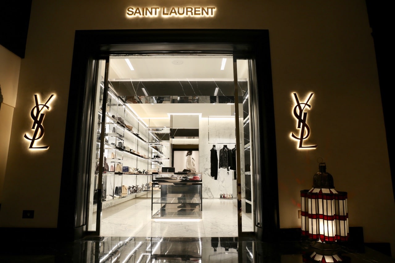 French fashion lovers indulge at Yves Saint Laurent and Dior boutiques.