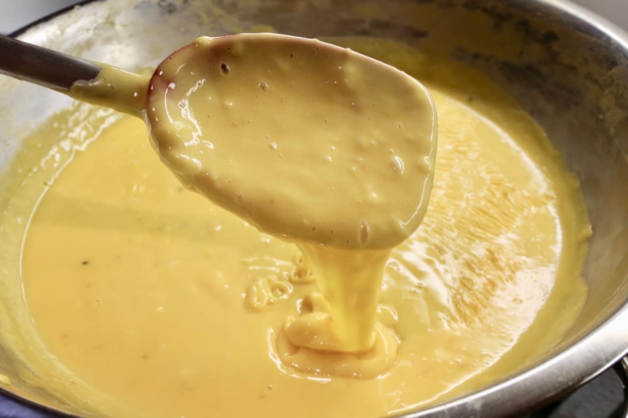 Your Velveeta Cheese Dip is finished once it runs smoothly off a spoon. 