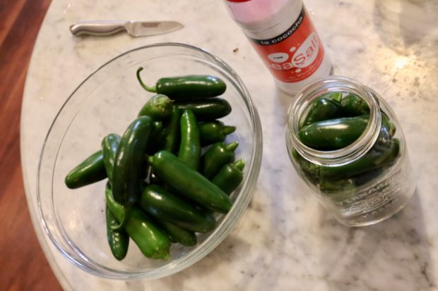 Ingredients you'll need to prepare fermented jalapeno peppers.