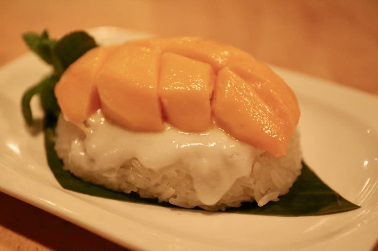 Mango and coconut sticky rice is a classic Thai dessert.