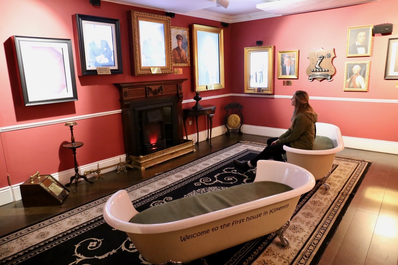 Sit in a bathtub while talking portraits share the Irish brewery's unique history.