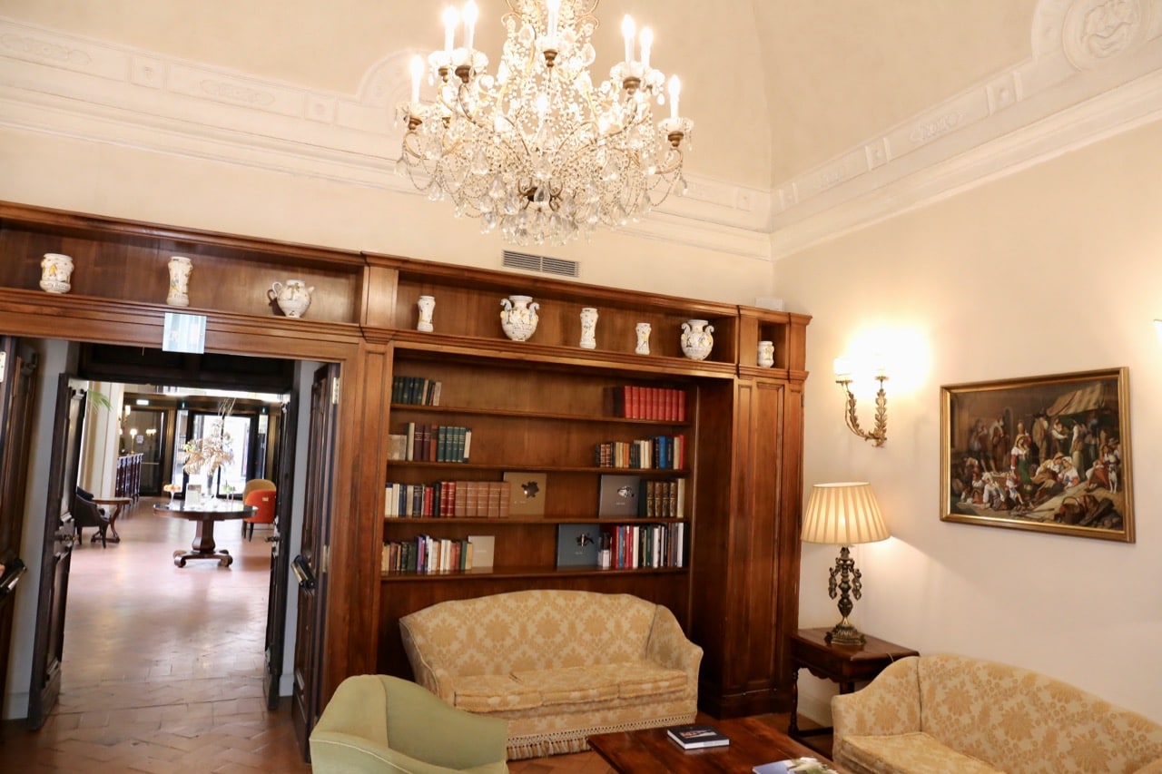 The cozy library at Grand Hotel Continental Siena.