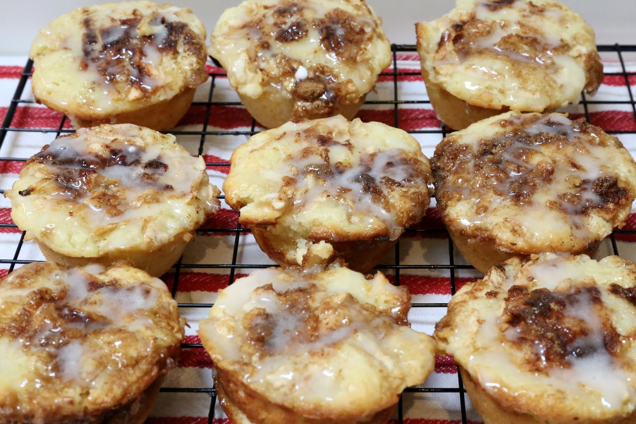 Once cooled, glaze Apple Fritter Muffins with creme icing and serve.