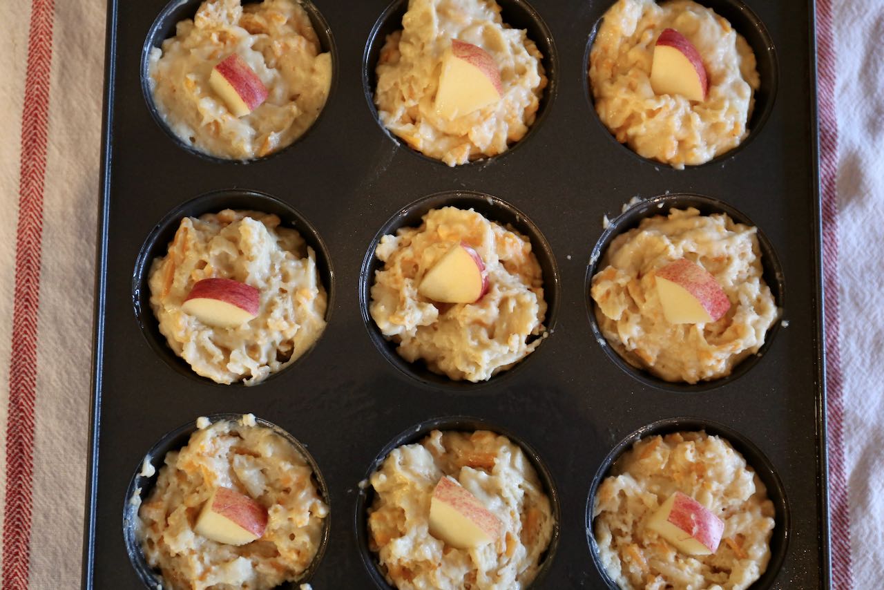 Cheddar Apple Muffins ready to bake in the oven.