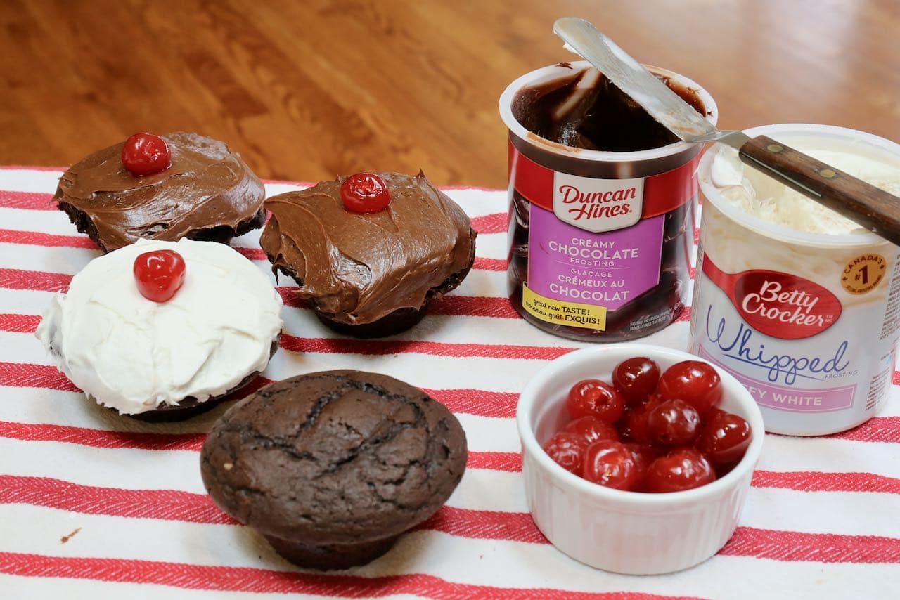 Decorate cupcakes with vanilla or chocolate icing and top with Maraschino cherries.