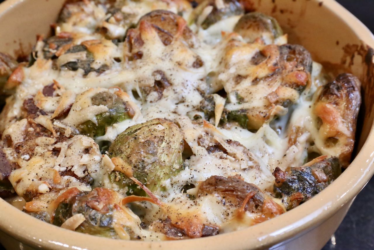 Serve brussels sprouts casserole with crispy cheese gratin hot out of the oven.