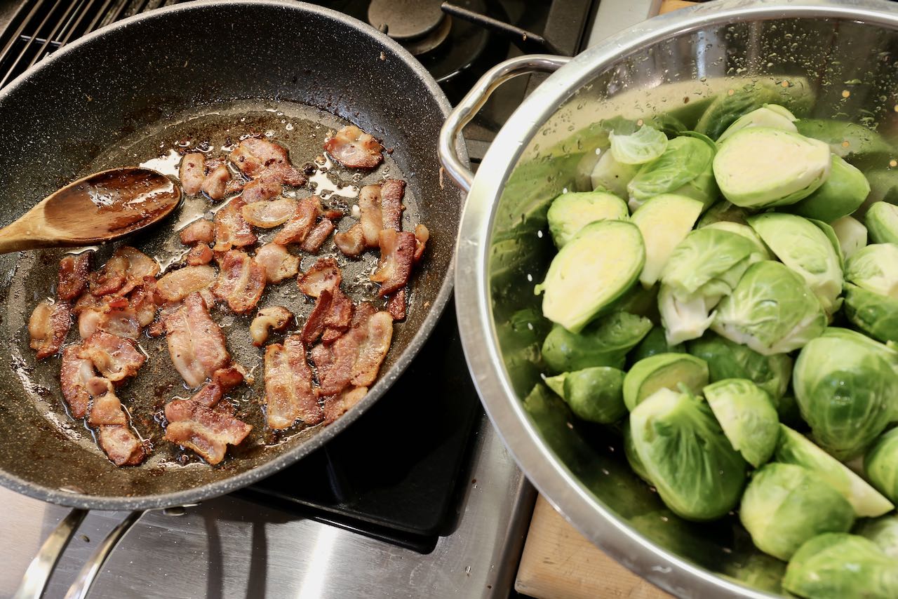 After frying bacon on the stove add washed and halved brussels sprouts.