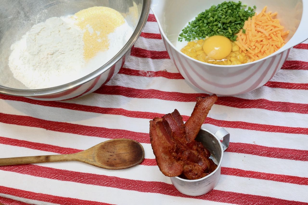 Prepare Cheese Bacon Muffins by mixing the dry and wet ingredients in separate bowls.