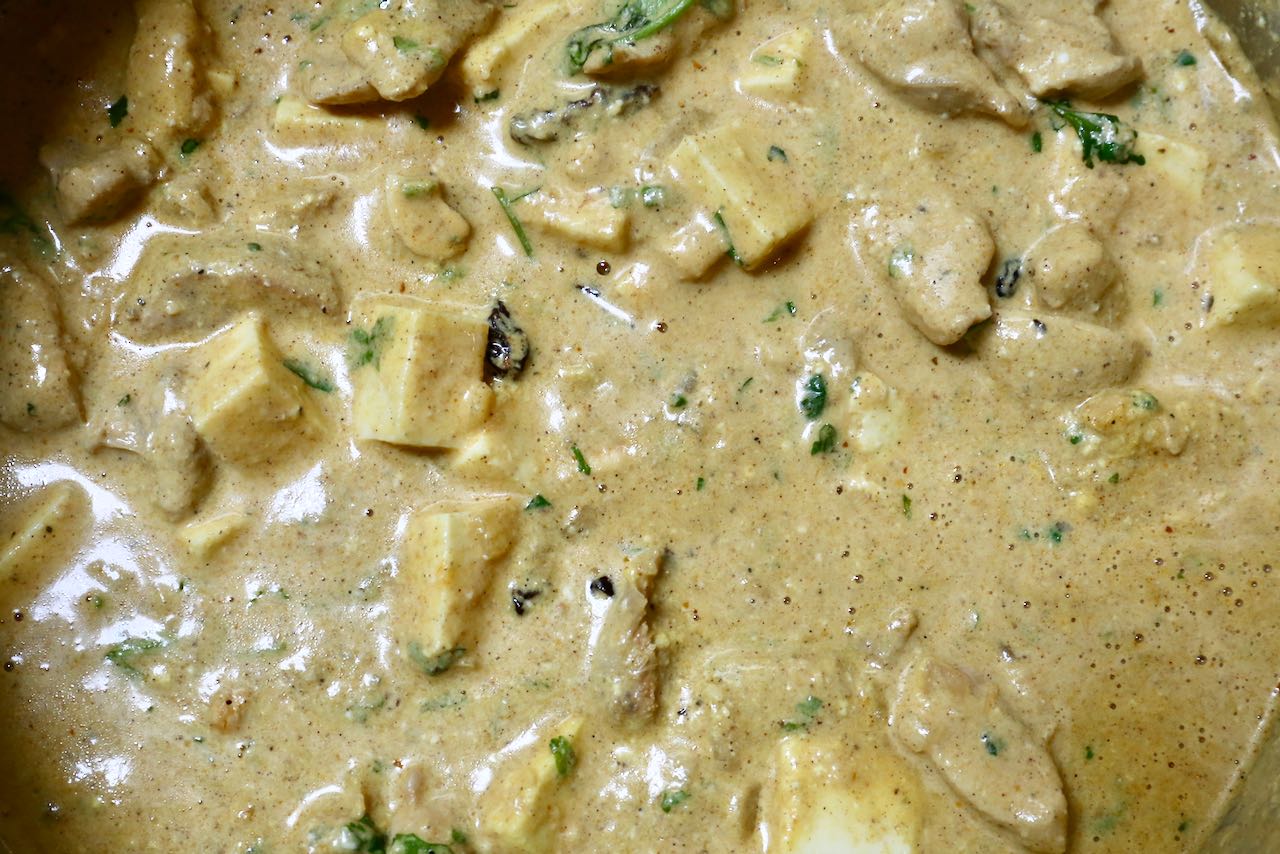 Simmer the chicken korma over low heat until you've achieved a thick gravy.