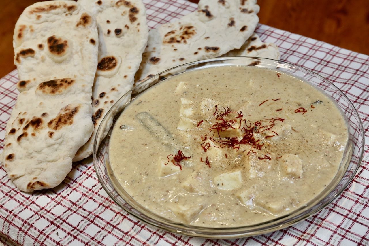 Serve vegetarian Shahi Paneer with naan or basmati rice.