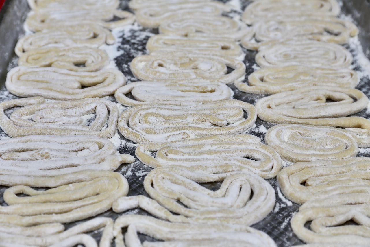 Pici Cacio e Pepe: Wrap pici pasta and toss in flour to prevent the dough from sticking. 