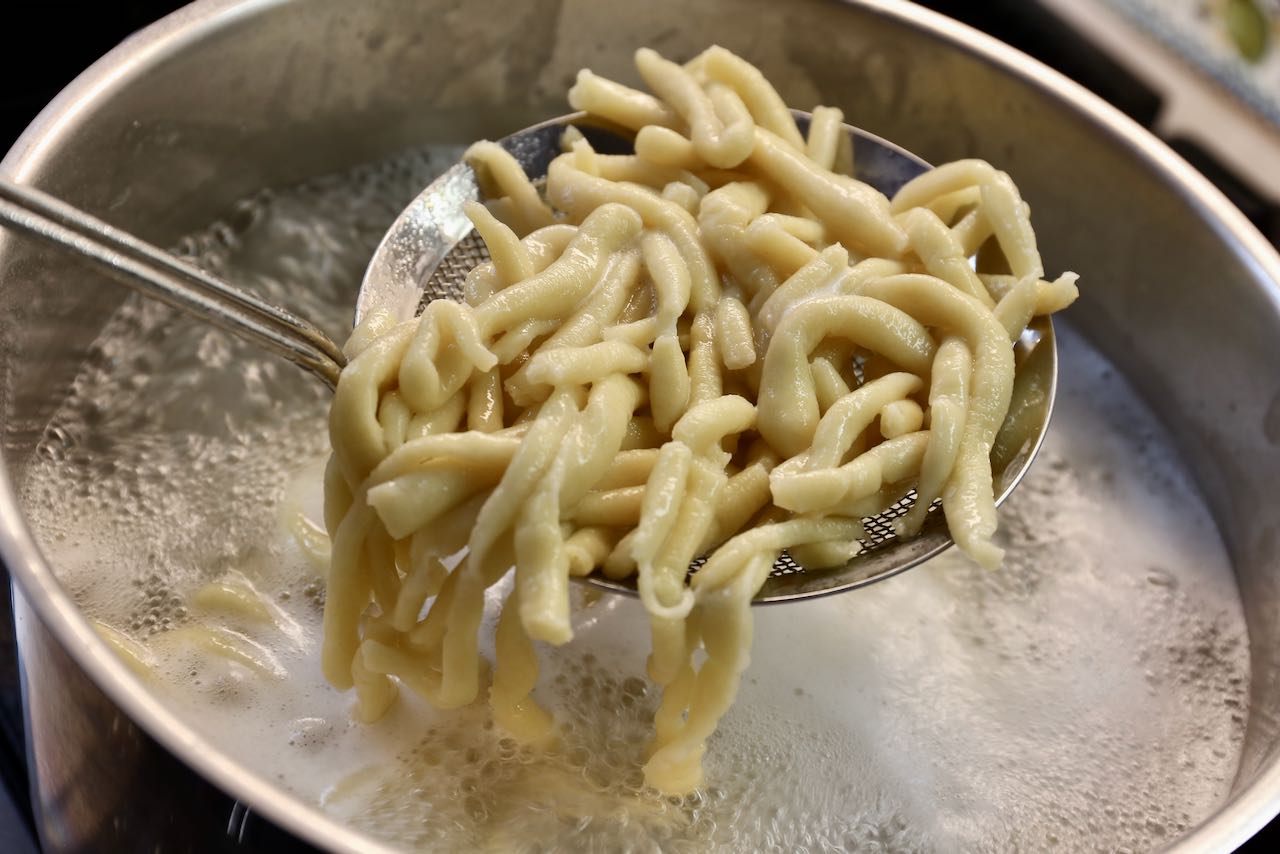 Pici Cacio e Pepe: Boil pasta for 5-7 minutes in salted water until al dente.