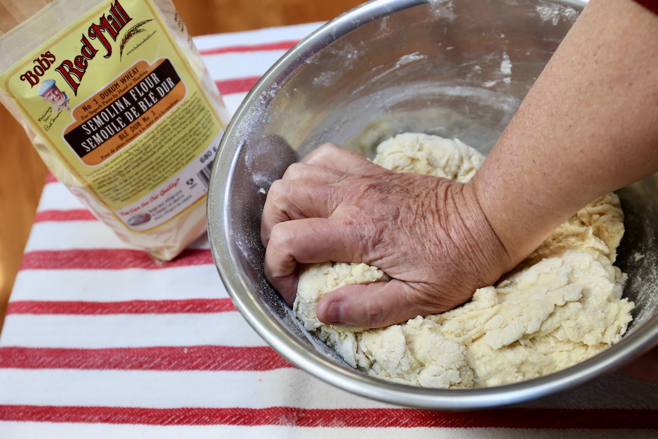 Knead in a large mixing bowl until the ingredients comes together in a shaggy dough.