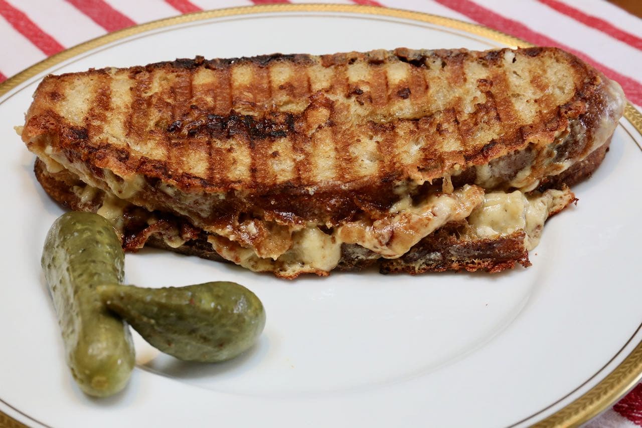 Serve Gruyere Grilled Cheese with pickles, ketchup, potato chips, soup and salad.