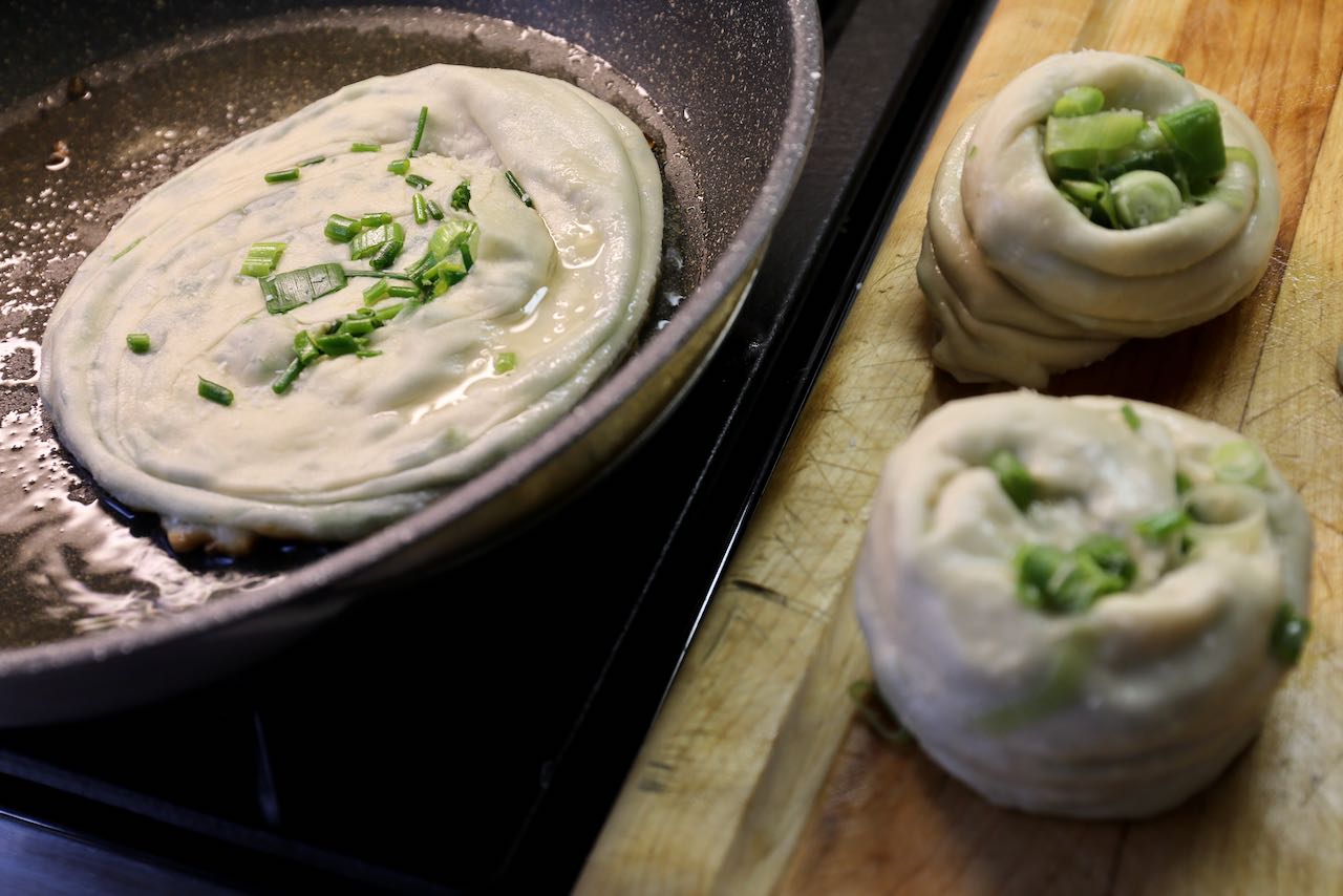 Fry Green Onion Cake in a non-stick pan over medium-high heat.