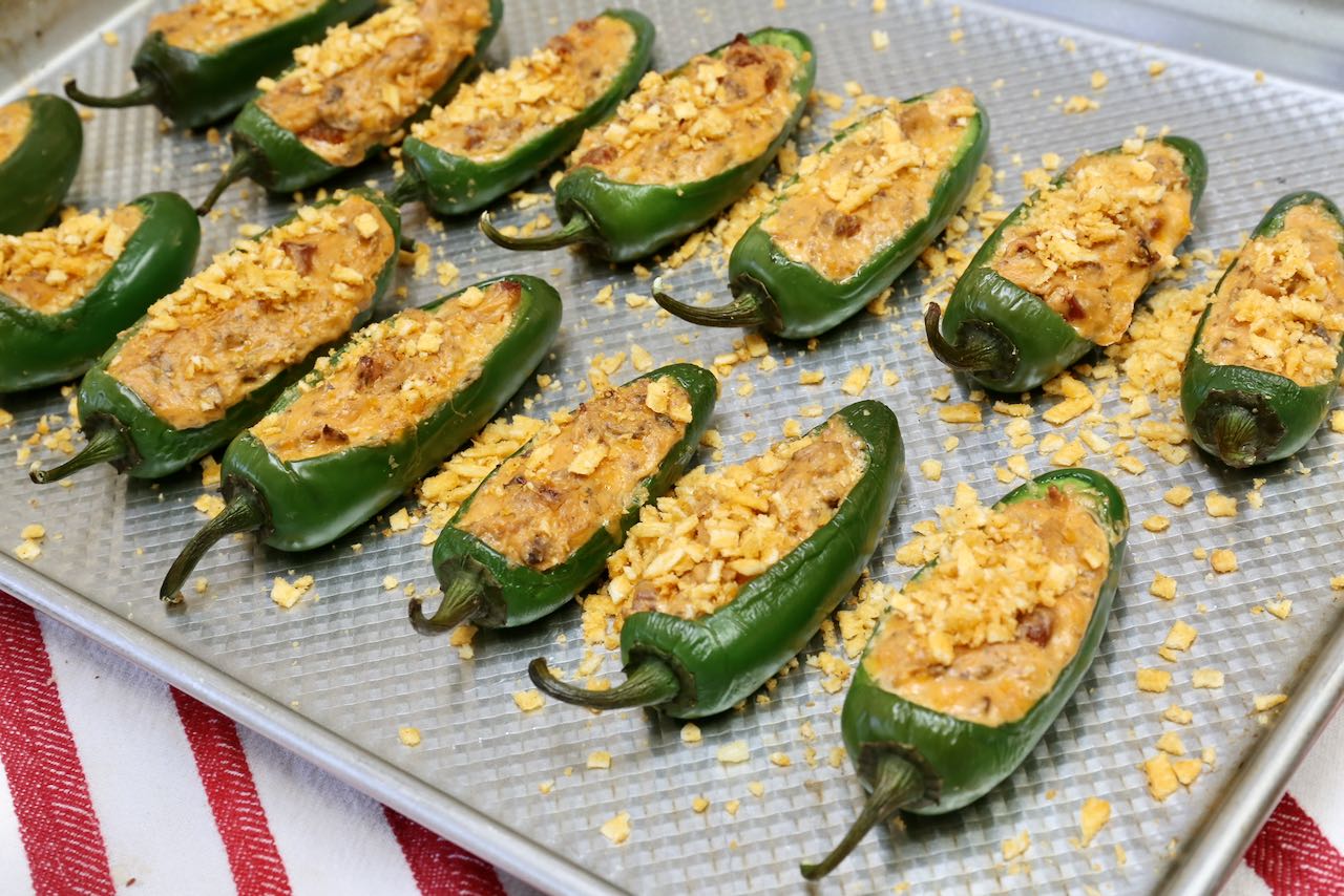 Bake Keto Jalapeno Poppers until bubbling and top with smoky hickory sticks. 