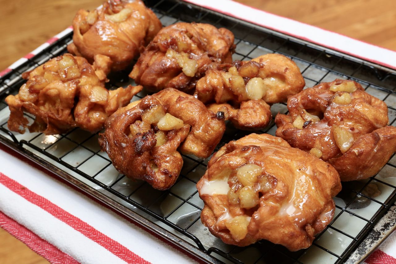 Deep fry crispy Sourdough Apple Fritters and top with a sweet glaze.