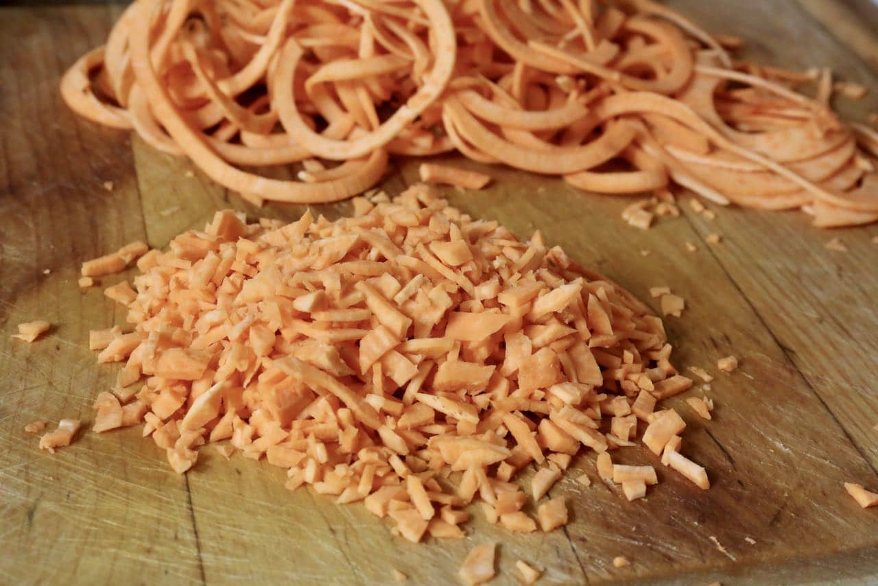 Chop the spiralized sweet potato with a sharp knife into pieces that are the size of rice. 