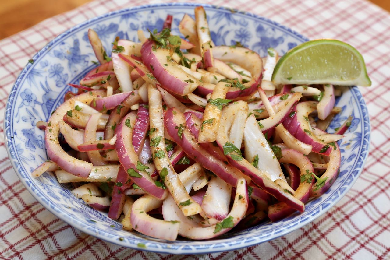 Serve Indian Onion Salad as a crunchy condiment with a slice of lime.