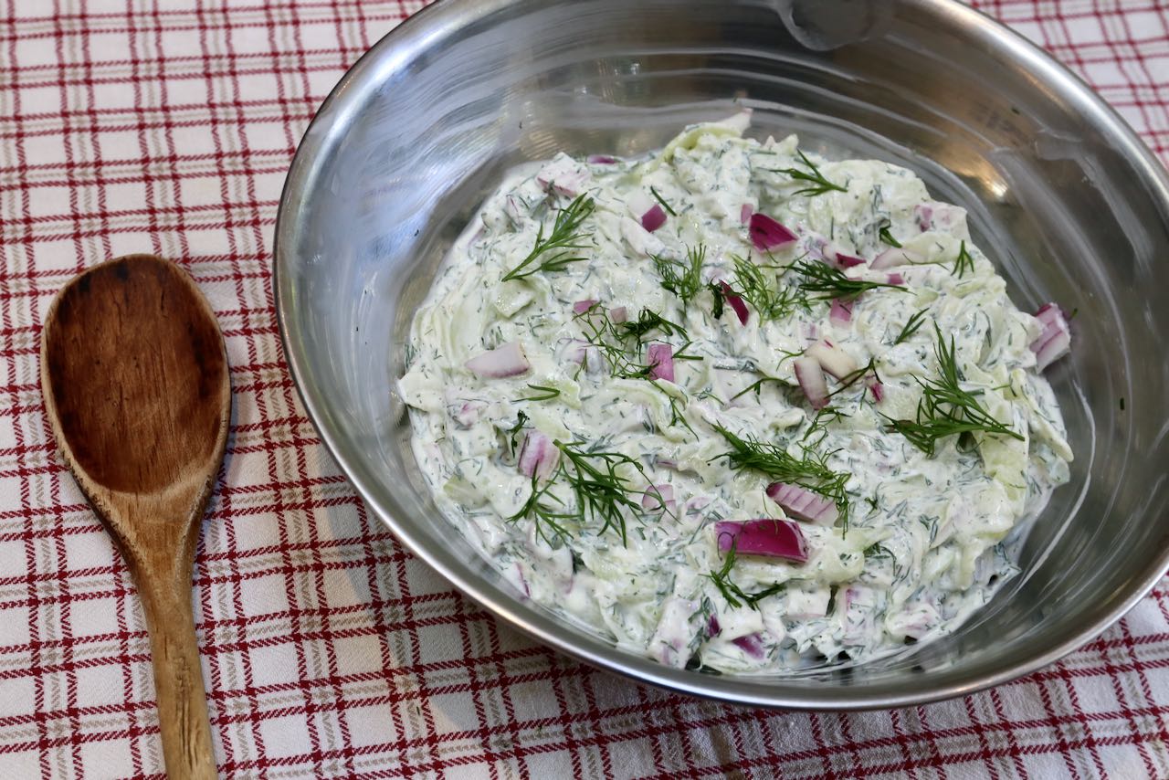 Top Polish Cucumber Salad with fresh dill and cool in the fridge until ready to serve.