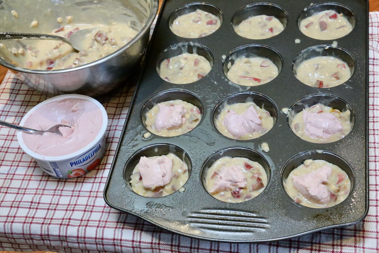 Fill healthy rhubarb muffins with strawberry cream cheese.