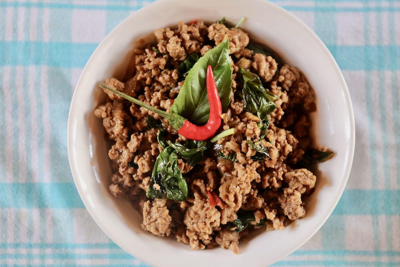 Serve authentic Pad Kra Pao topped with a spicy Thai red chili.