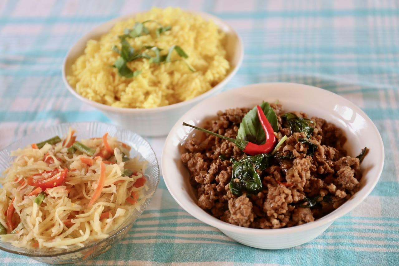 Serve our traditional Thai minced pork basil stir fry with turmeric rice and green papaya salad.