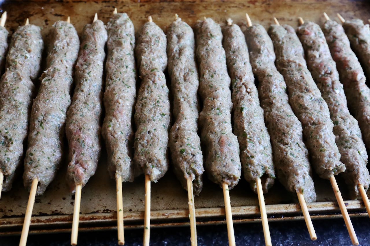 Store Beef Kafta skewers on a baking sheet in the fridge until ready to cook on the barbecue or in the oven.