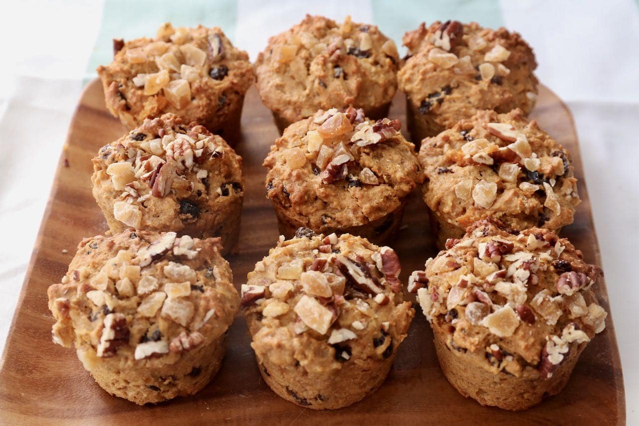 Healthy Sweet Potato Muffins topped with pecans and crystalized ginger.