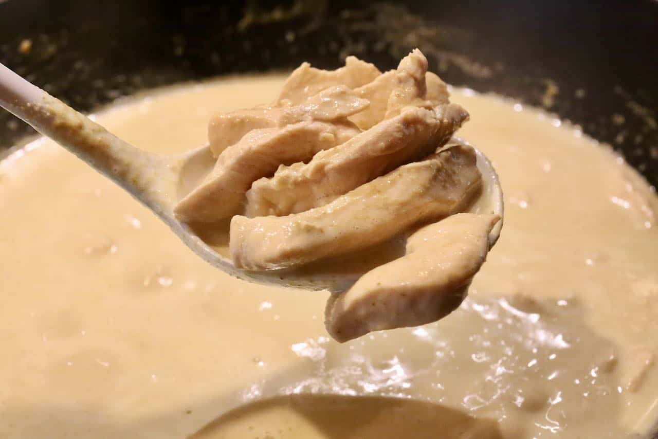 Sliced chicken is cooked coconut cream and Thai Green Curry Paste in authentic Gaeng Keow Wan recipes.