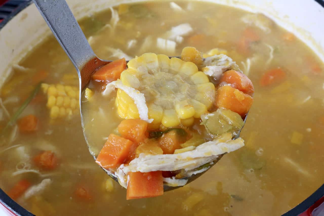 Once finished cooking, use a ladle to spoon Ajiaco Cubano into soup bowls.