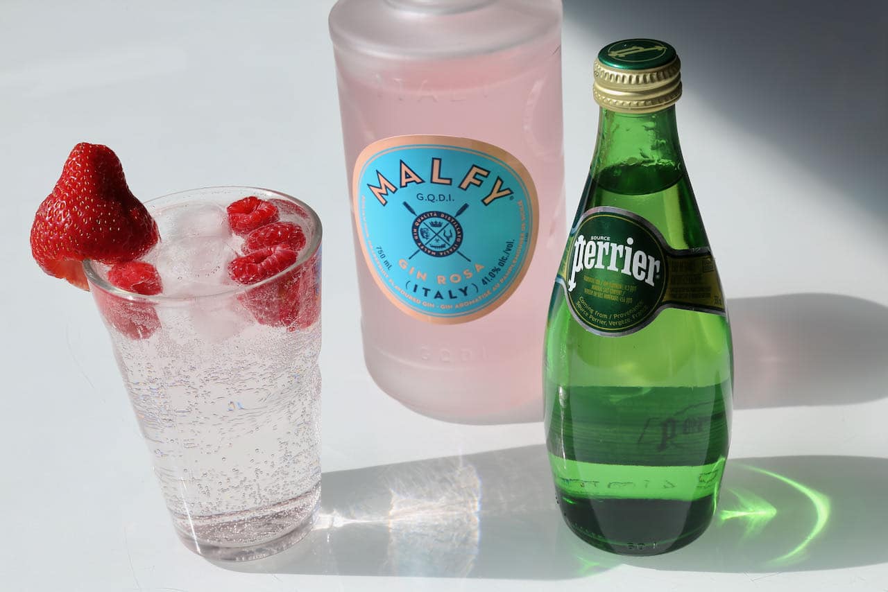 The easiest of the Pink Gin Cocktails is simply muddled with soda and simple syrup. 