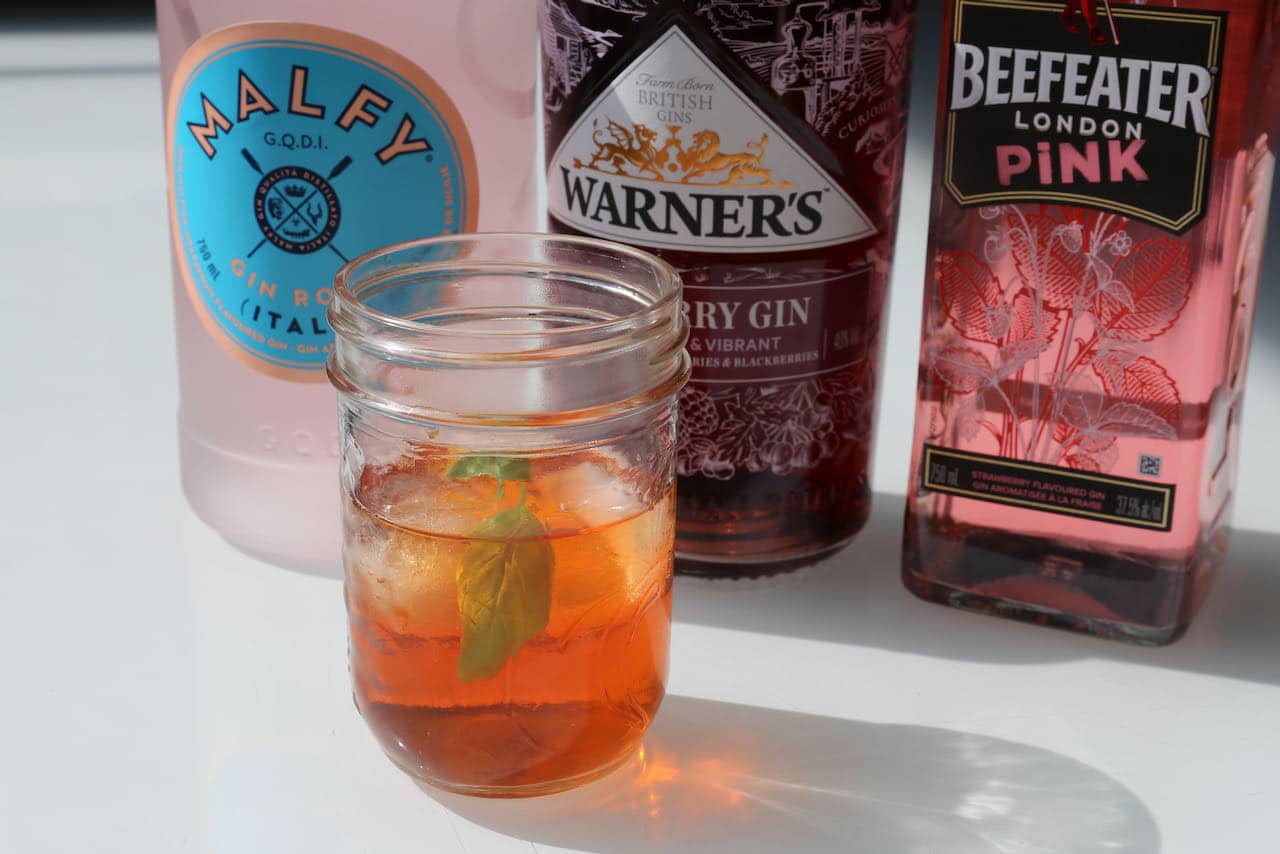 Best pink gin cocktails for Italy lovers is a Pink Negroni with red vermouth, aperol and basil.