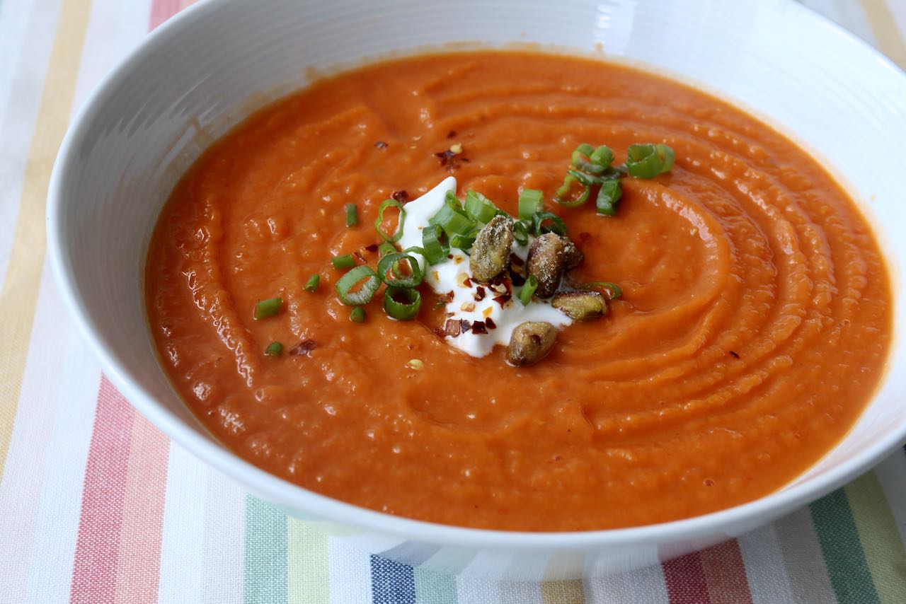 Garnish soup with sour cream, pistachio, scallions and red pepper flakes.