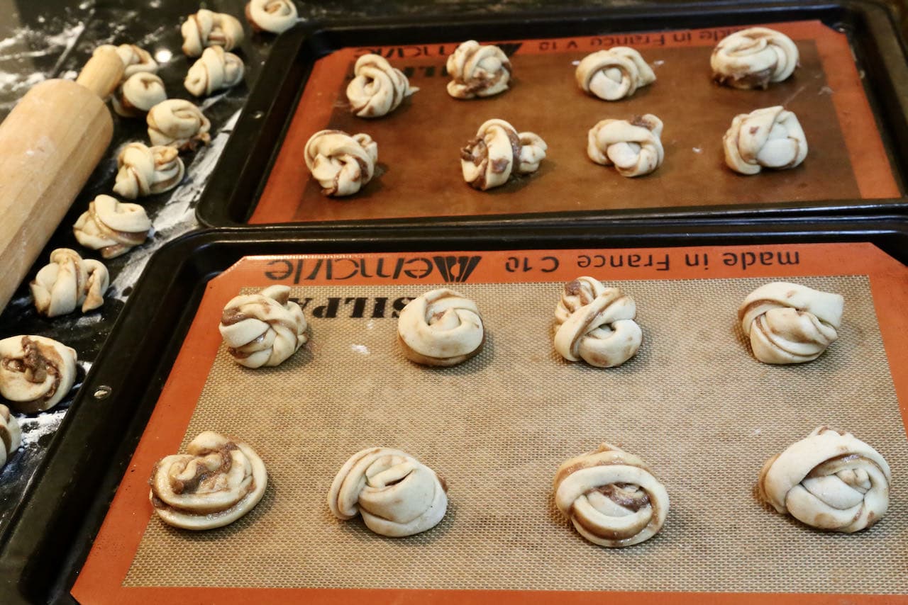 Let Swedish Cardamom Buns rest and rise on baking sheets. 