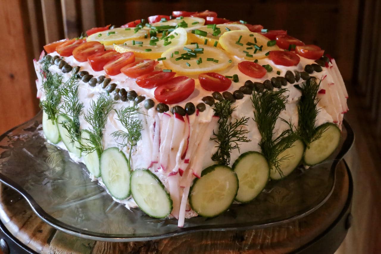 Have fun decorating the Smorgastarta with cucumbers, radishes, capers, tomatoes, lemon slices and fresh herbs.