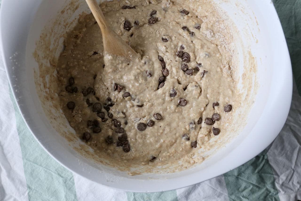 Add chocolate chips to the moist Buttermilk Banana Muffin batter before scooping into greased tins.