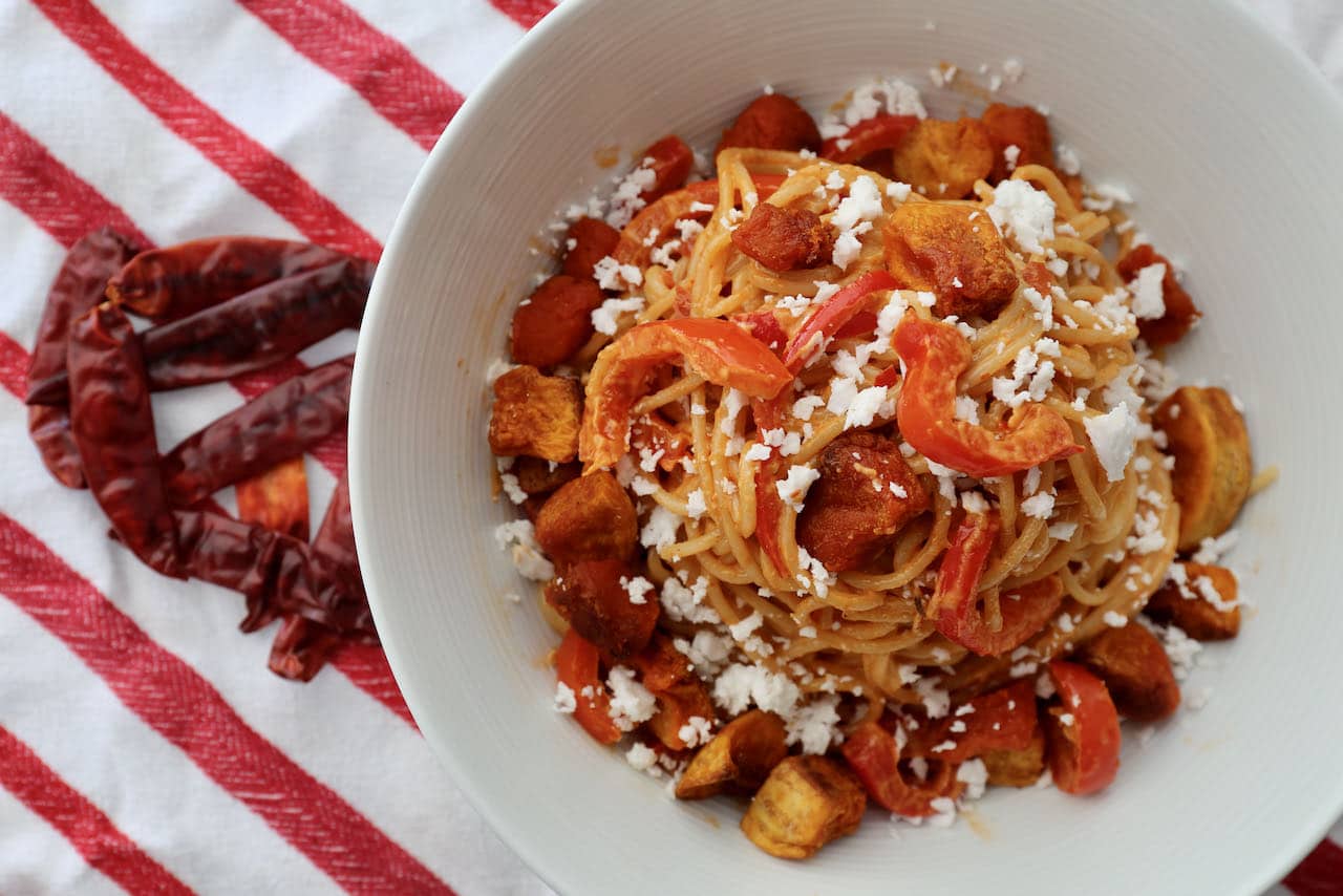 Serve Harissa Pasta topped with crumbled feta cheese. 
