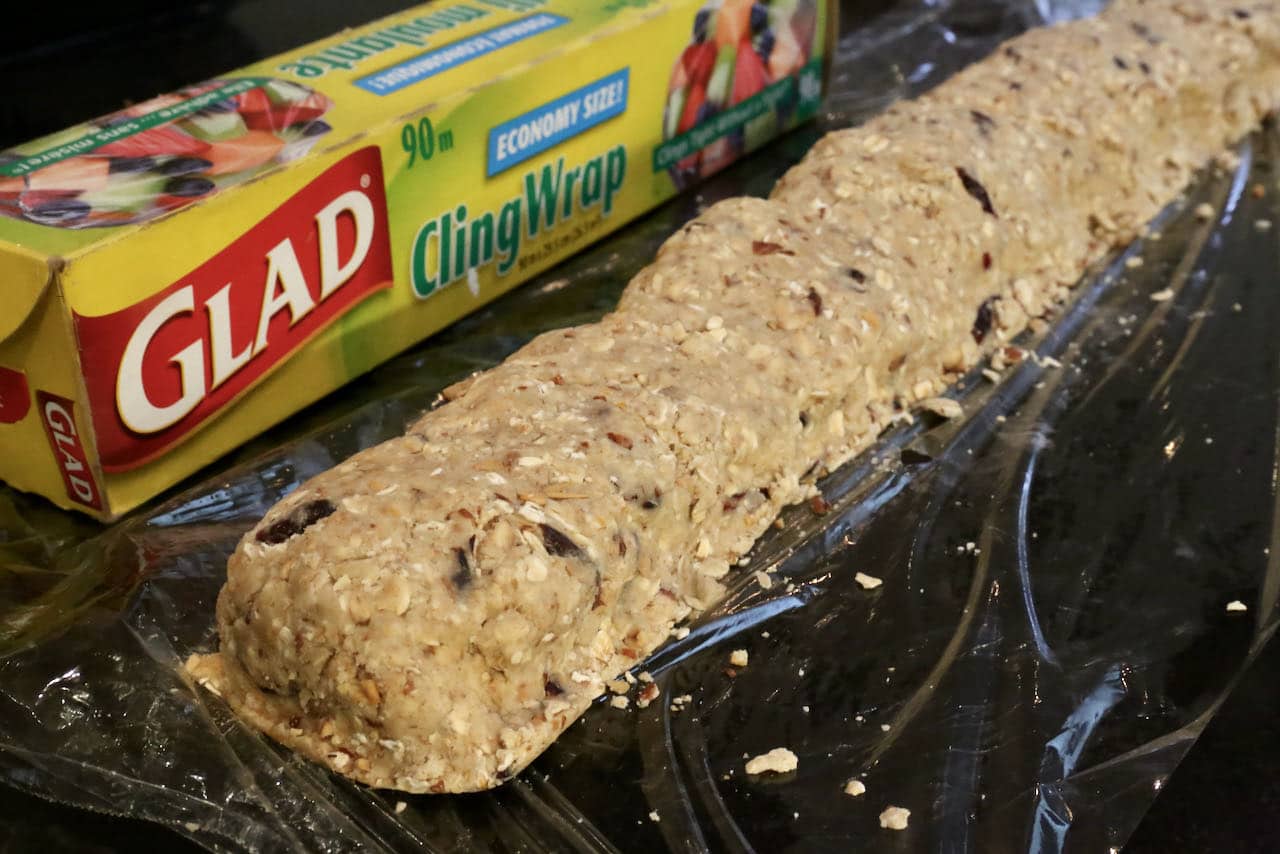 Roll and wrap Healthy Oatmeal Cranberry Cookie dough with plastic wrap and cool in the freezer.