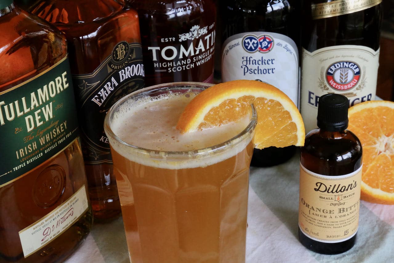 Garnish a Beer and Whiskey Cocktail with a fresh orange slice or dehydrated orange.