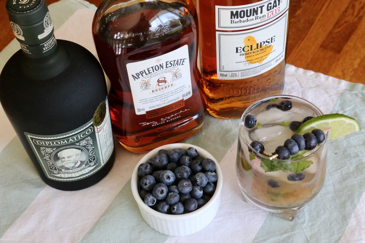 Serve a Blueberry Mojito with whole ice cubes or crushed ice in a highball or rocks glass.
