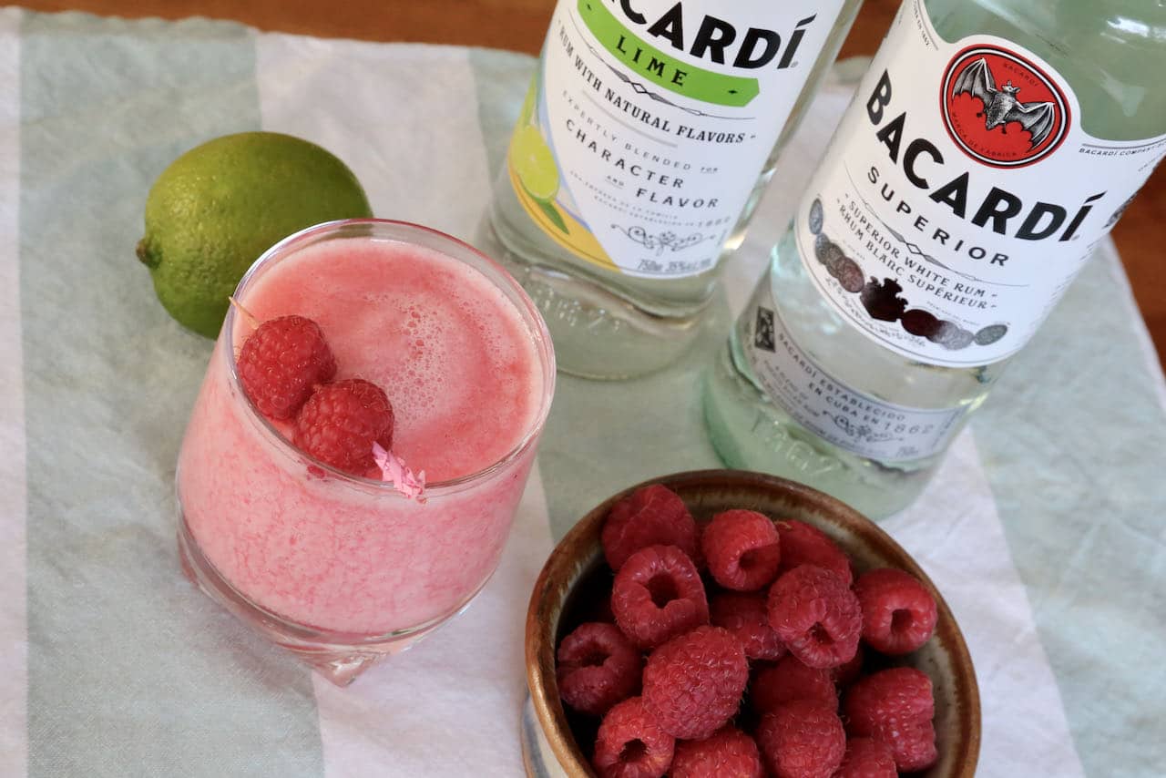 Our easy daiquiri recipe is garnished with fresh raspberries.