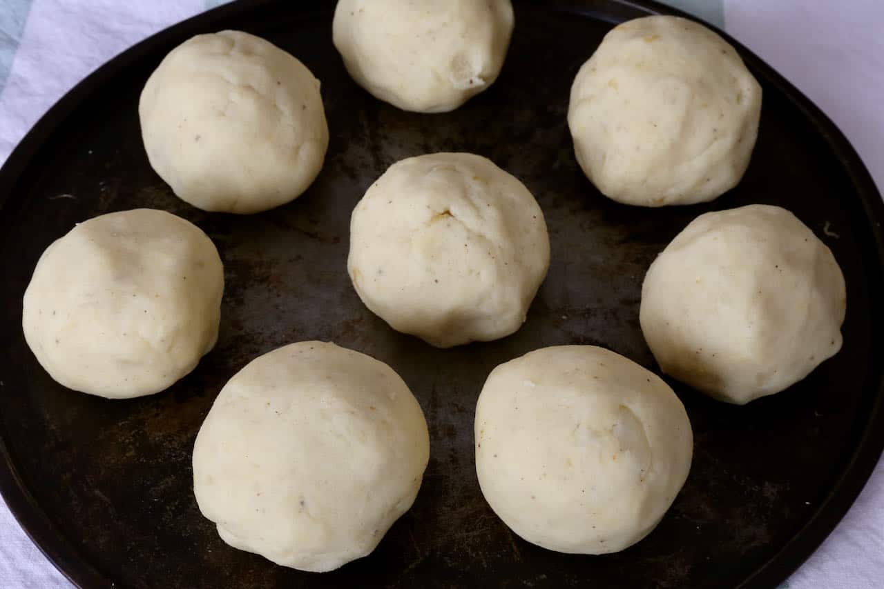Let Kartoffelknödel rest on a baking sheet before boiling.
