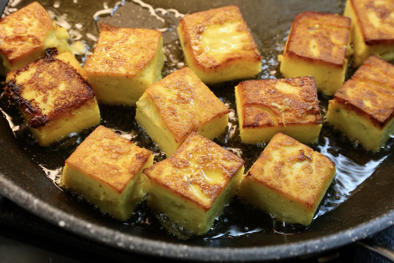 Fry Pitod Ki Sabji chickpea dumplings in oil until lightly browned and crispy.