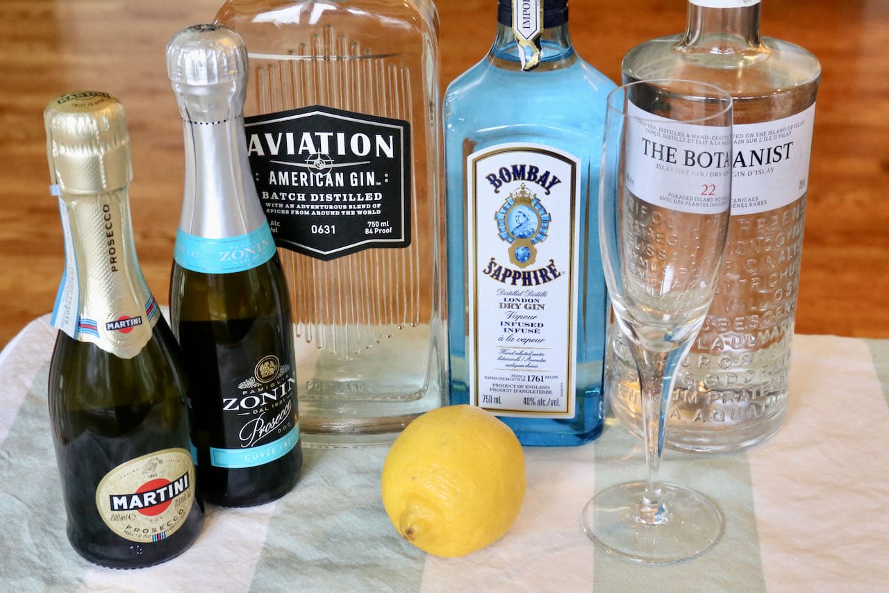 Prosecco and Gin Cocktail ingredients include gin, lemon juice, syrup, prosecco and lemon twist.