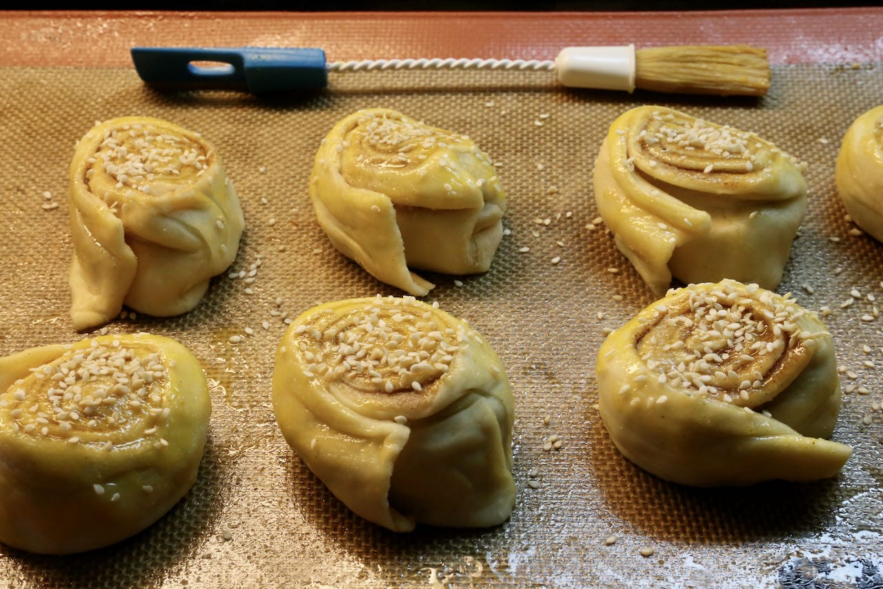 Brush Tahini Rolls with egg wash and sprinkle with sesame seeds.