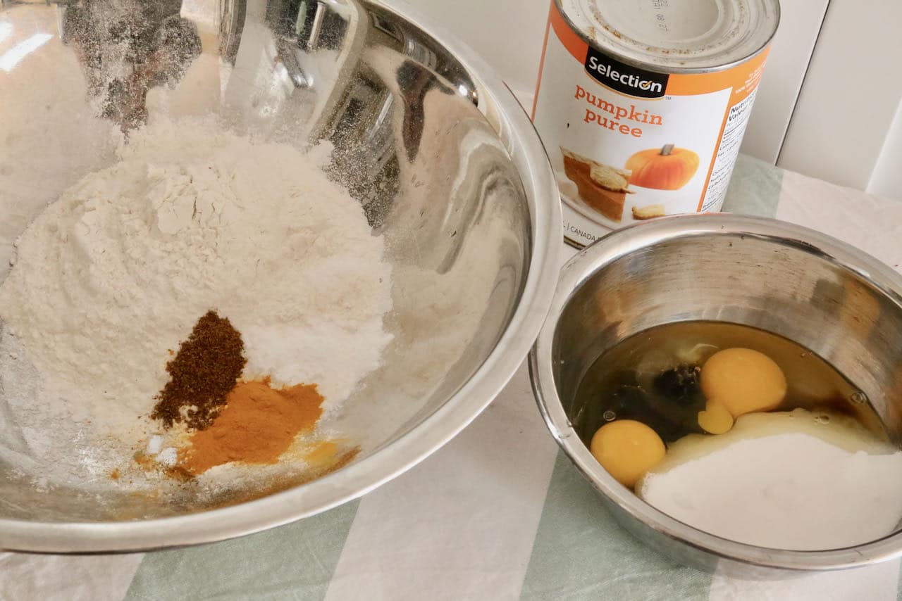 Prepare Indian Cake recipe by mixing dry and wet ingredients in separate bowls.